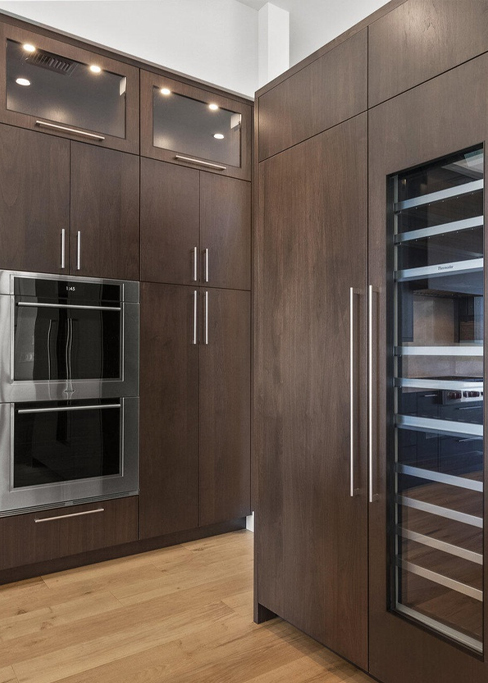 Remodelled kitchen with new cabinetry, stone countertops and updated lighting