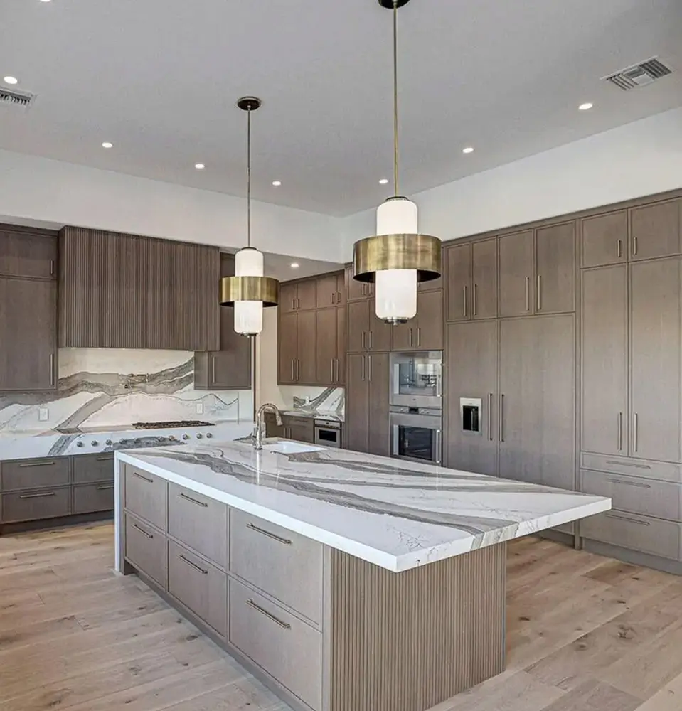 Natural stone countertop with dramatic veining in a finished kitchen